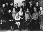 Portrait of a large family from Saxony, Germany, Aug 1943; note mother with Cross of Honor of the German Mother, six sons in military service, and two son in Hitler Youth
