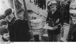 Marine Hitler Youth presenting their naval logs for German Navy submariners