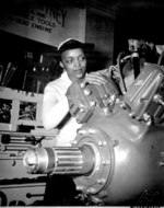 African-American US Navy WAVE Apprentice Seaman Frances Bates inspecting an engine for a Wildcat fighter aircraft, US Naval Training School, Bronx, New York, United States, 1945