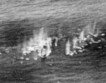 Small Taiwanese vessel being stafed by PB4Y-2 aircraft of US Navy VPB-104, just off Dongji Island, Pescadores Islands, 7 Aug 1945