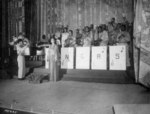 Josephine Baker singing the American national anthem before an African-American US Army band directed by Technical Sergeant Frank W. Weiss, Municipal Theater, Oran, Algeria, 17 May 1943