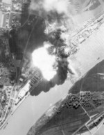An oil tank explosion at Deggendorf harbor, Bavaria, Germany after an aerial bombardment by A-20 Havoc aircraft of US 426th Bomb Group, 20 Apr 1945