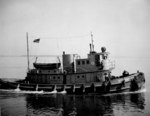 US Navy tug boat YTM 466 at the Mine Warfare School, Yorktown, Virginia, United States, 17 May 1945; the boat