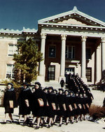 WAVES students marching out of Morrill Hall, Naval Training Center, Stillwater, Oklahoma, United States, Mar 1943; note the women were wearing raincoats and havelocks but the sky was clear