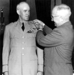 US President Harry Truman pinning the five-star general insignia onto Omar Bradley