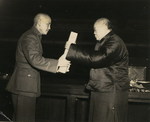 Chairman of the Chinese National Assembly Wu Zhihui ceremonially delivering a copy of the Constitution of the Republic of China to Chiang Kaishek, Nanjing, China, 25 Dec 1946