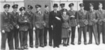 Hugh Dowding with an aide and several British fighter pilots outside the Air Ministry headquarters at the Adastral House (now Television House), London, England, United Kingdom, 14 Sep 1942