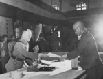 Japanese China Expeditionary Army Chief of Staff Asasaburo Kobayashi surrendering to He Yingqin, Nanjing, China, 9 Sep 1945, photo 3 of 3