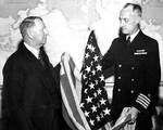 Capt James Doyle presented Knox the first US flag over Japanese territory (Kwajalein), 29 Feb 1944