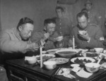 Li Mi dining with fellow officers, Jiangsu Province, China, late 1948