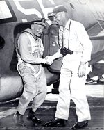 US Navy Captain Harold Martin greeting VAdm John McCain, Sr. after a trap landing aboard light carrier San Jacinto, late 1944; seen on page 113 of US Navy War Photographs
