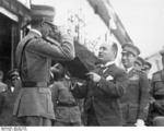 Benito Mussolini commending an air force squadron leader during an inspection, near Milan, Italy, Sep 1931