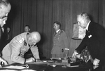 Benito Mussolini signing the Munich Agreement, Germany, 30 Sep 1938, photo 1 of 2