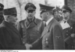 Philippe Pétain and Adolf Hitler, Montoire-sur-le-Loir, France, 24 Oct 1940; note Paul Schmidt and Joachim von Ribbentrop in background