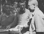 US General Stilwell discussing tactics with Chinese Generals Sun Li-jen and Liao Yaoxiang, Burma, Mar 1944