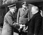 Adolf Hitler greeting President Jozef Tiso of Slovakia, Berlin, Germany, Oct 1941; note Alexander von Dörnberg in background