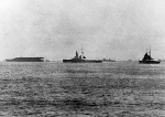 Kaga (misidentified as Akagi) and Hiei (misidentified as Kongo) in harbor, circa 1932-34; the ship at far right is a Takao-class heavy cruiser