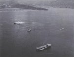 USS Makin Island (foreground), a Cleveland-class light cruiser (center), and a Haven-class hospital ship (furthest from camera) in Wakanoura Bay, Wakayama, Japan during the evacuation of Allied prisoners of war, mid-Sep 1945