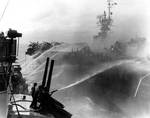 Birmingham attempted to fight fires aboard Princeton, 24 Oct 1944, photo 1 of 2