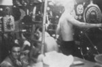 Men working in the control room aboard USS Wahoo, 27 Jan 1943 while at 300 feet during a depth charge attack by a Japanese destroyer. They had taken 6 depth charges and were awaiting more.