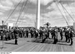The Oslo, Norway police orchestra playing music for the wounded soldiers aboard hospital ship Wilhelm Gustloff, 1940, photo 2 of 2