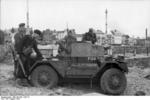 German troops inspecting a British Daimler Scout Car captured during the failed raid on Dieppe, France, late Aug 1942