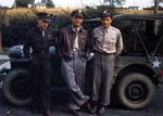 Three pilots of the 332nd Bomb Group, US Army 9th Air Force posing in front of a Jeep, Great Sailing, Essex, England, UK, Feb-Sep 1944