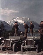 Members of the US 101st Airborne Division, 327th Glider Infantry pausing in the Bavarian Alps near Berchtesgaden, Germany for some photographs for the folks back home, before June 1945