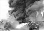 German SdKfz. 251/16 No. 644 halftrack vehicle torching a building with a flamethrower, Russia, Aug 1944, photo 1 of 3