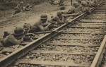 Japanese troops guarding a section of a railway near the village of Changxindian, Hebei Province, China, west of the city of Beiping, 10 Aug 1937; seen in the 1 Sep 1937 issue of the Japanese publication Asahigraph