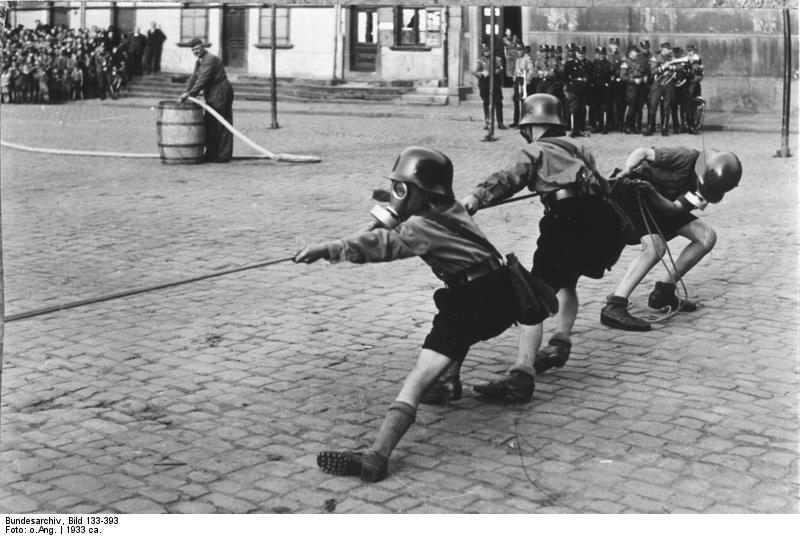 Føde regiment Styrke Photo] Hitler Youth members playing tug of war while donning helmets and gas  masks, 1933 | World War II Database