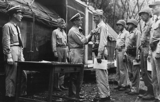 Admiral Chester Nimitz awarding Lieutenant Colonel Evans Carlson a gold star to his Navy Cross medal, Guadalcanal, Solomon Islands, 30 Sep 1942