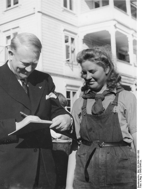 A Norwegian female worker receiving Minister President Vidkun Quisling's autograph, circa 1943-1944
