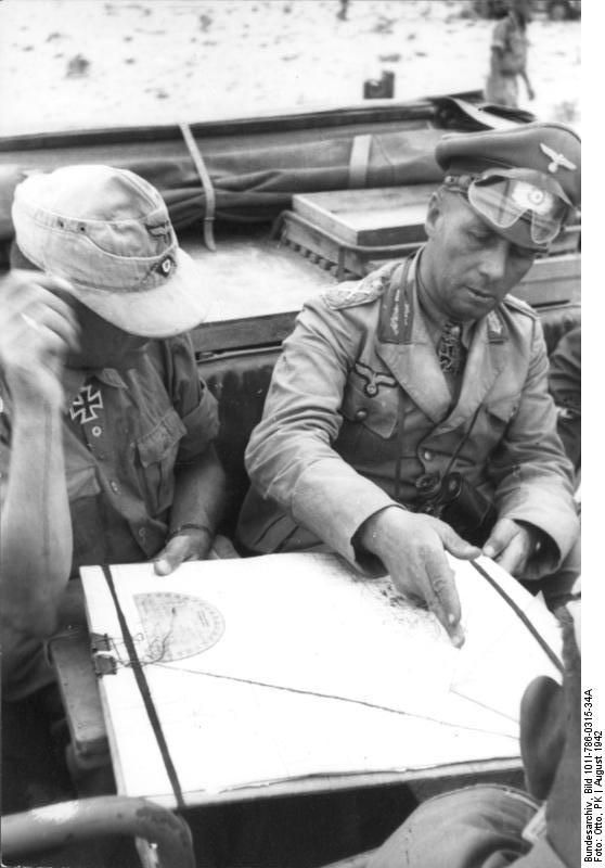 Rommel studying a map with his staff officers, North Africa, Aug 1942