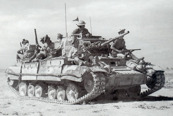 Valentine infantry tank of UK 23rd Armoured Brigade carrying Scottish troops of the UK 51st Highland Division in North Africa, circa mid to late-1942; note the right-most soldier carrying a captured Italian Beretta Model 38 submachine gun