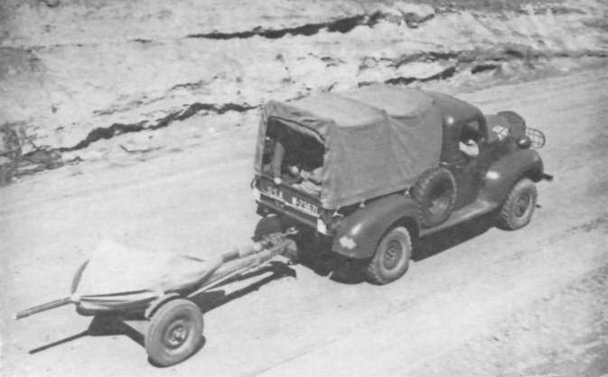 37 mm Gun M3 being towed by a truck, circa 1941