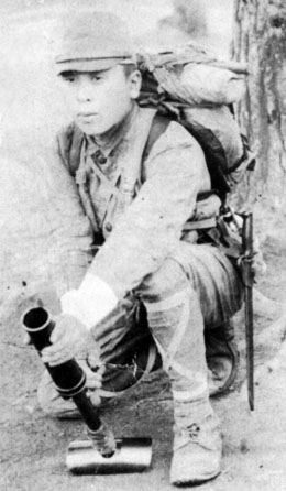 Japanese soldier posing with a Type 89 grenade launcher, circa 1940s