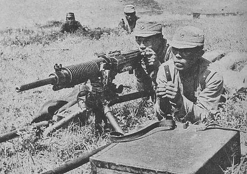 Manchukuo troops manning a Type 92 heavy machine gun, circa 1940s; seen in the book 'Japanese Colonial History, Volume 2' of the 'History of the 100 Million People Under Emperor Showa' collection, published by Mainichi Newspaper Company