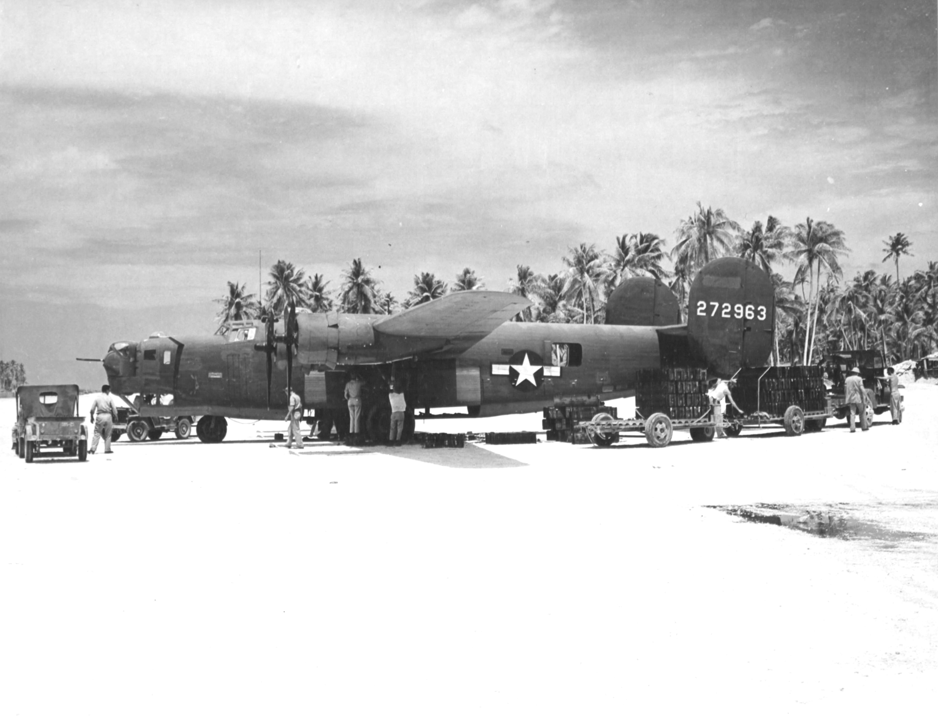 B-24D Liberator of the 42nd Bomb Squadron being loaded with fragmentation bombs at Funafuti, Gilbert and Ellice Islands, Nov 18 1943.