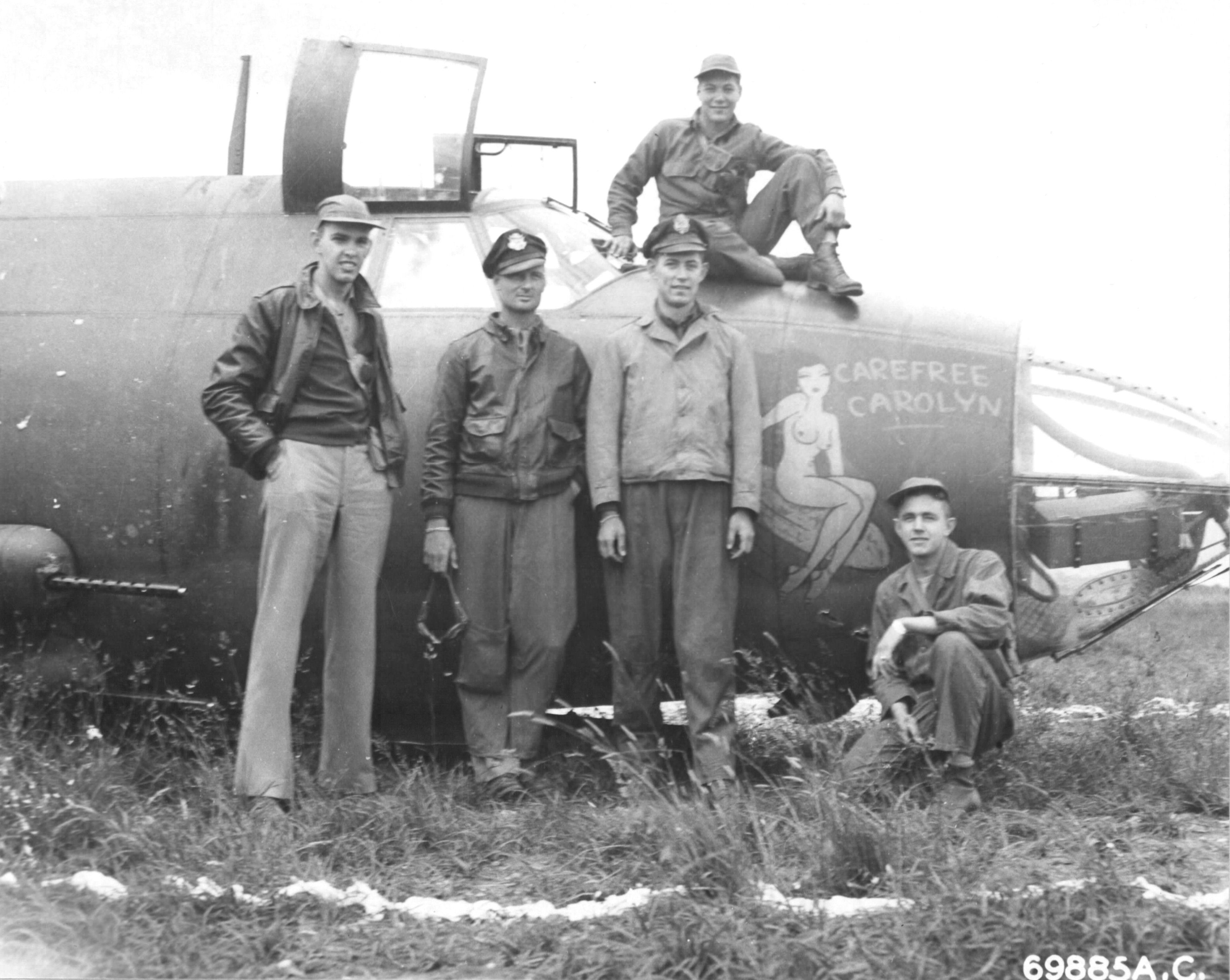 Crew of B-26C Marauder “Carefree Carolyn” of the 552nd Bomb Squadron in front of their airplane after making a wheels-up landing, RAF Great Dunmow, Essex, England, June 15 1944. This was the aircraft’s 100th mission. Photo 2 of 2