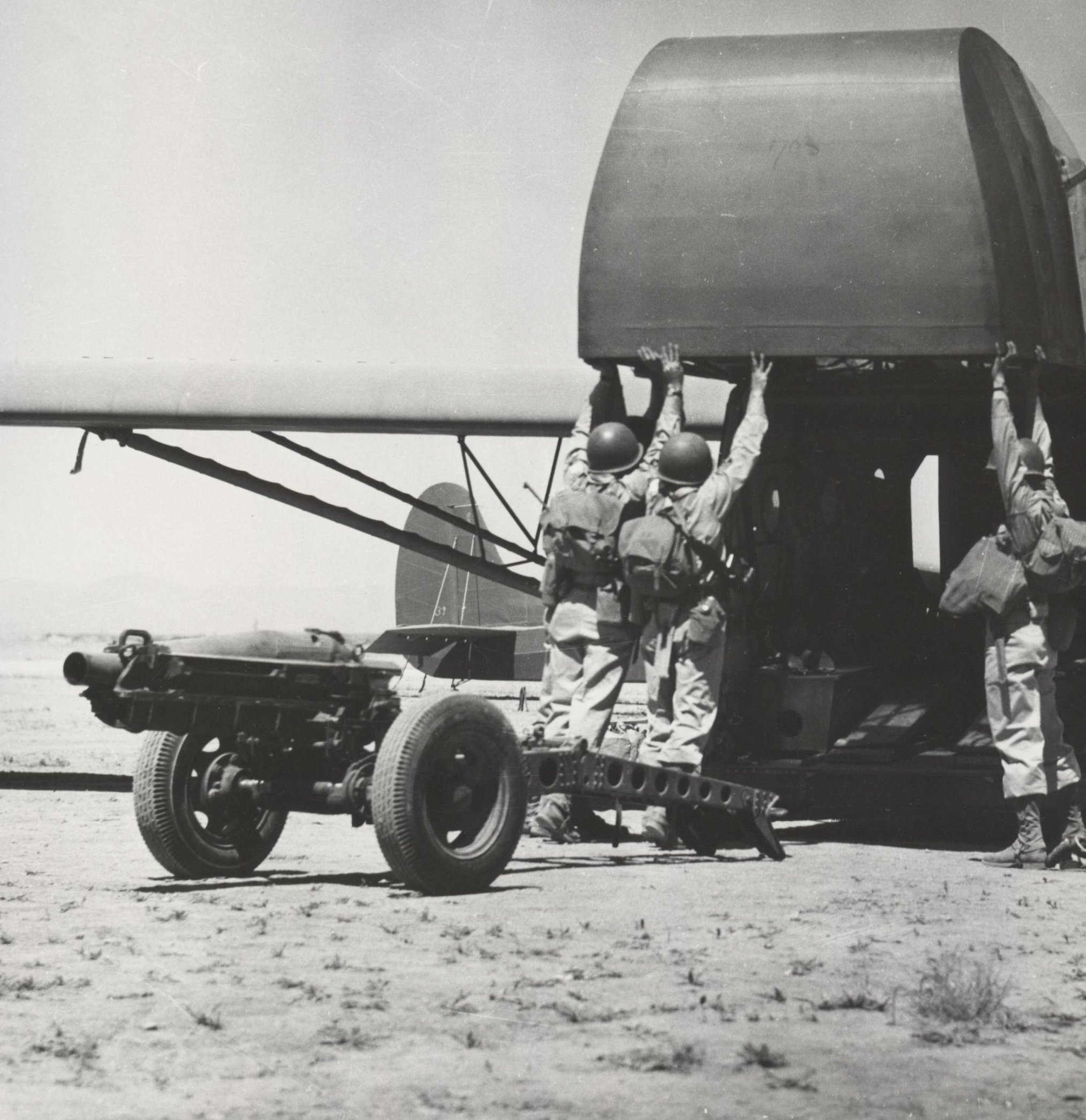 82nd Airborne load a 75mm howitzer into a CG-4A Troop Glider during training at Oujda, French Morocco, North Africa a month before the Sicily invasion, Jun 11 1943.