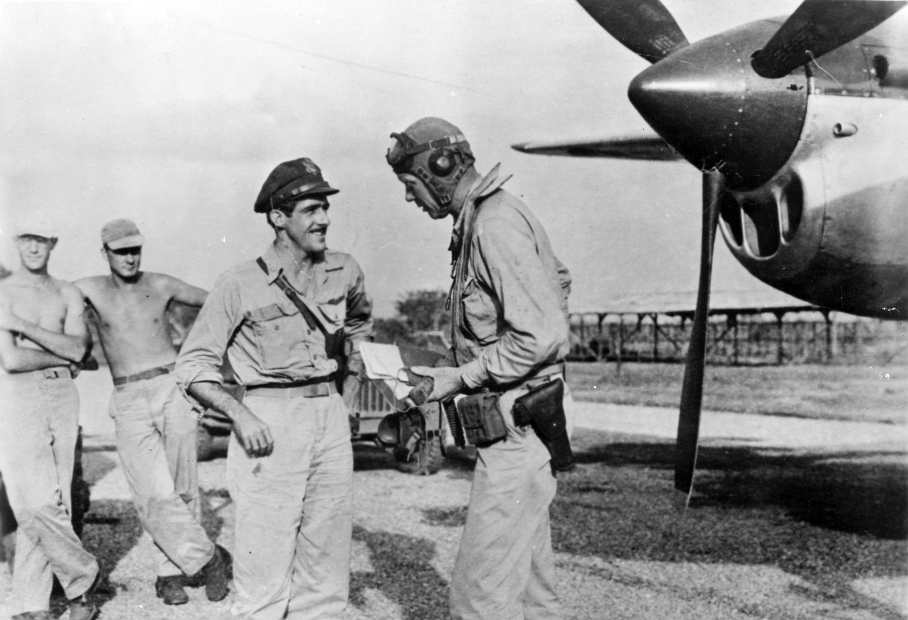 USAAF Maj Thomas McGuire and Aviator Charles Lindbergh after returning from a combat mission, at Biak Island off New Guinea, Jul 1944. Note P-38 Lightning. Lindbergh helped with economical flight techniques to extend the range of P-38s.