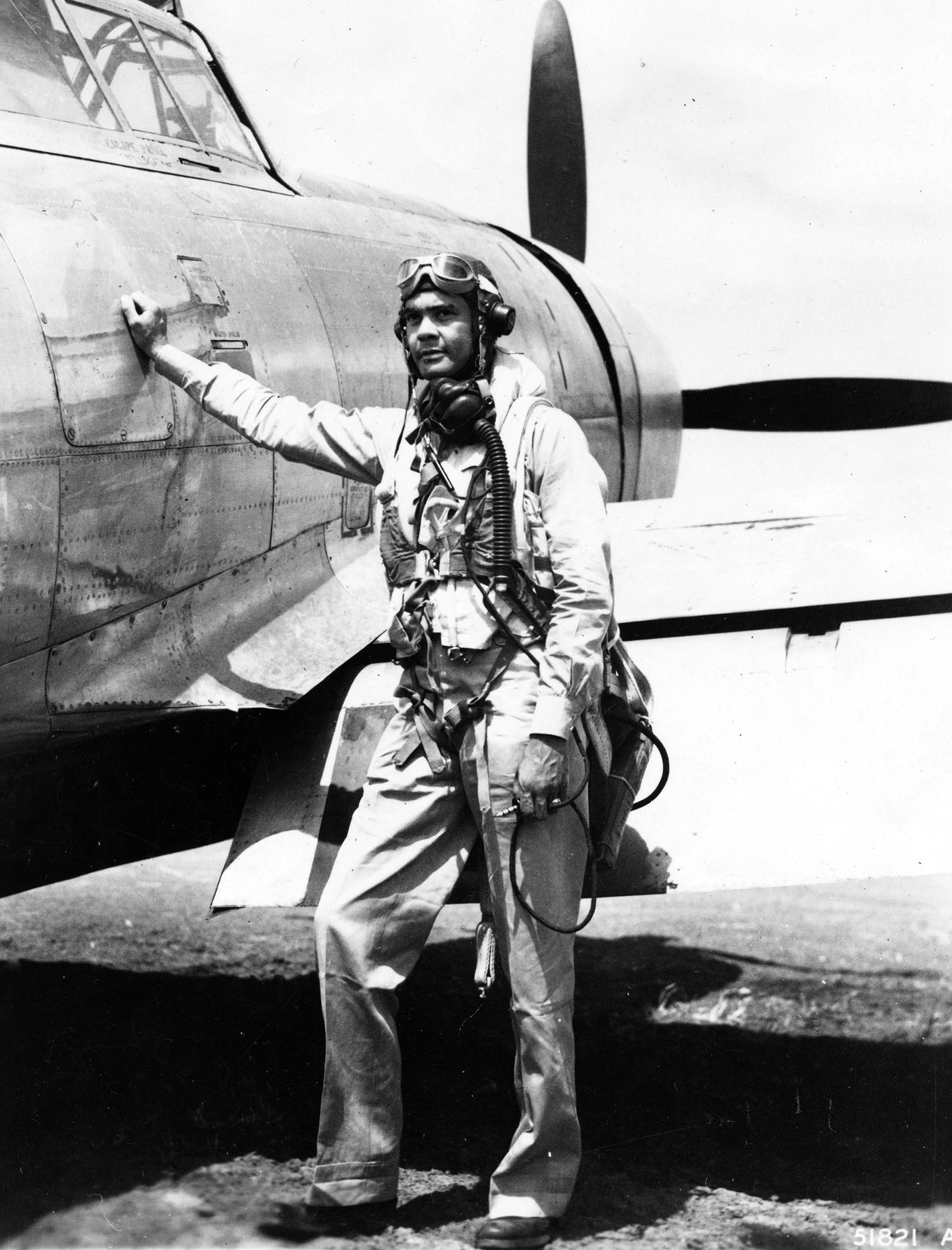 Col Benjamin O Davis, Commanding Officer of the 322nd Fighter Group, stands next to his P-47 Thunderbolt fighter, date and location unknown