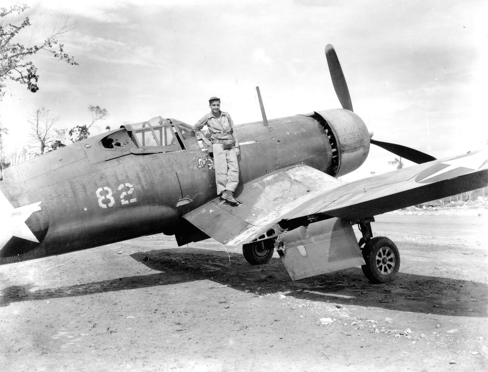2Lt Harry S Huidekoper, USMCR of VMF-213 poses aboard the hulk of F4U-1 Corsair “George,” Munda Airstrip, New Georgia, Solomon Islands, Sept 1943. This aircraft previously flew with VMF-122.