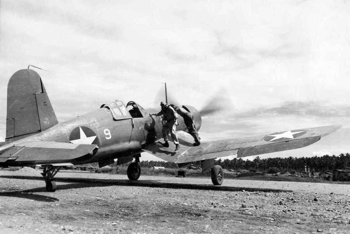 Major Gregory Weissenberger, Commanding Officer of Marine Fighting Squadron 213, the “Hellhawks,” getting into his F4U-1 Corsair with the engine running, Guadalcanal, Solomons, 1943.