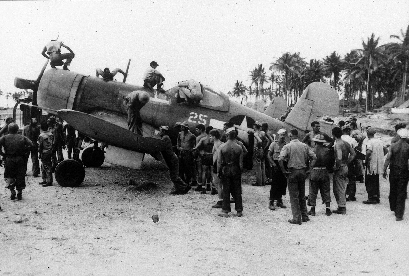 A badly damaged F4U-1A Corsair of Marine Squadron 216 flown by a wounded Lt Robert Marshall managed to return safely to Torokina, Bougainville, Solomons after an encounter with a swarm of A6M Zeros over Rabaul, New Britain, Dec 19 1943. Photo 1 of 5.