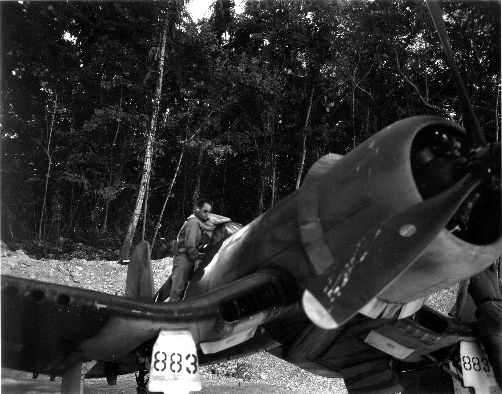 Marine Major Gregory “Pappy” Boyington, Commanding Officer of VMF-214 the “Black Sheep” and later Medal of Honor recipient, boards his F4U-1 Corsair at the Barakoma airstrip on Vella LaVella Island, Solomons, Dec 1943.