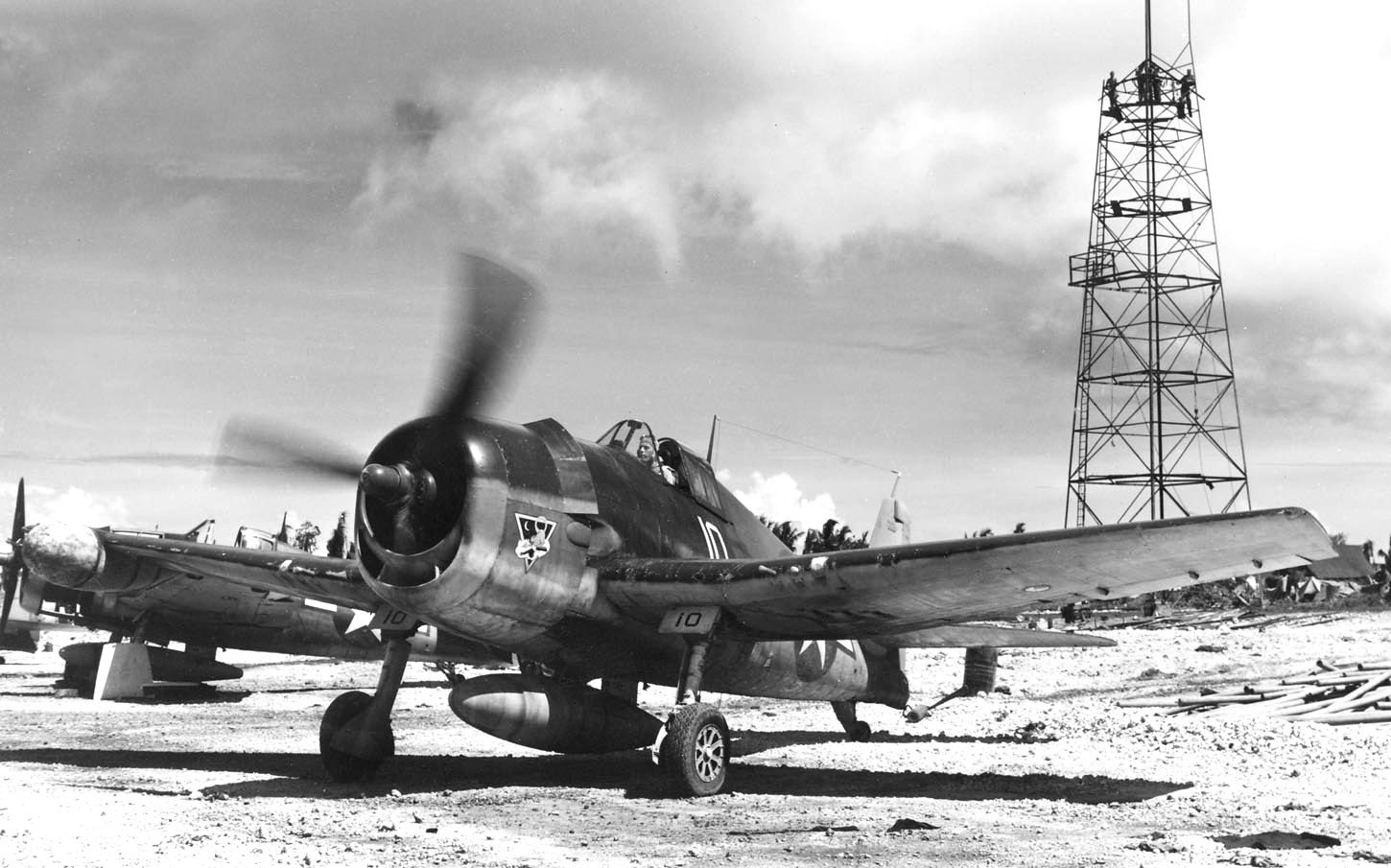 F6F-3N Hellcat night fighter of Marine Night Fighter Squadron 534 running up its engine at Orote airfield, Guam, Marianas, Aug 21 1944. Note radome on left wing.