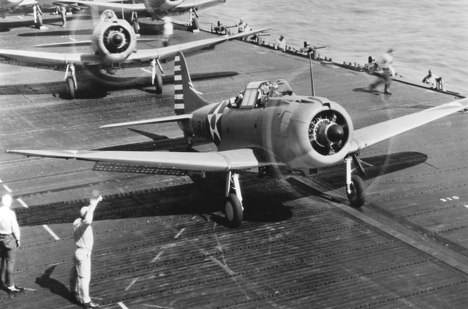 An SBD-3 Dauntless dive-bomber of Bombing Squadron 6 prepares for launch from the carrier USS Enterprise, early 1942.