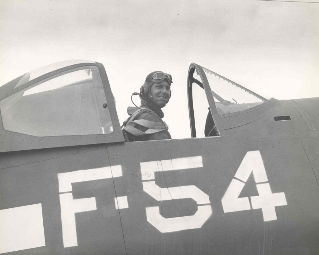 A Naval aviator in the cockpit of an F4U Corsair aboard the training aircraft carrier USS Sable on Lake Michigan, United States, 1945.